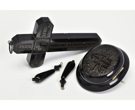 THREE ITEMS OF JEWELLERY, to include a mid Victorian hinged jet locket brooch, the central panel with engraved monogram, open