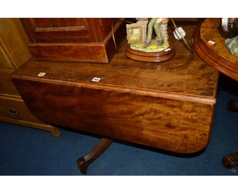 AN EARLY 19TH CENTURY MAHOGANY DROP LEAF RECTANGULAR OCCASIONAL TABLE, fitted with an end drawer and dummy drawer, on a turne