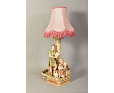 A ROYAL DUX STYLE FIGURAL LAMP BASE, depicting figures handpainting pottery, impressed No291 to base, approximate height 39.5