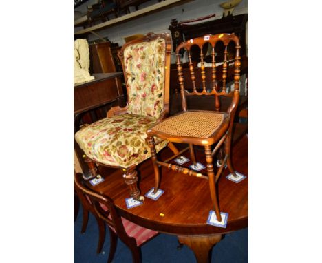 A LATE VICTORIAN WALNUT BUTTONED BACK CHAIR on ceramic casters together with a 20th Century mahogany cane seated chair (2)