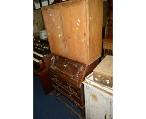 A PINE CABINET, together with an oak fall front bureau and a darts board with double doors (3)