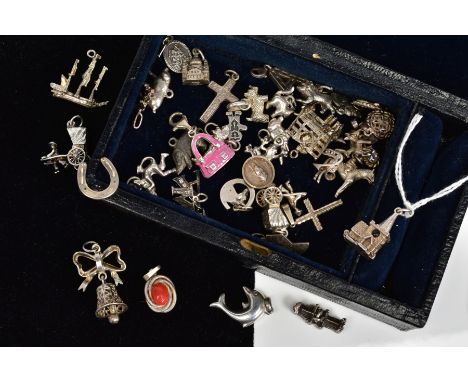 A SELECTION OF MAINLY CHARMS, to include a hinged church charm with Stanhope 'Window' showing the Lord's Prayer, a gingerbrea