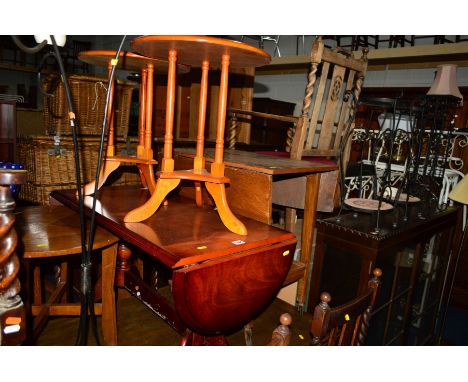 A REPRODUCTION MAHOGANY DROP END COFFEE TABLE together with a walnut circular occasional table, an Egyptian style leather pou