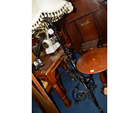A 20TH CENTURY BLACK GROUND WROUGHT IRON TELESCOPIC STANDARD LAMP with foliate and scrolled decoration and a fabric shade