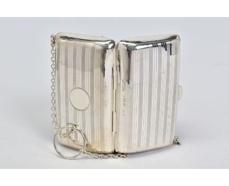 A GEORGE V SILVER PURSE, horizontal engine turned stripe decoration, leather lined interior, on chain with finger ring, maker