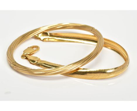 A 9CT GOLD BRACELET AND A HINGED BANGLE, the bangle of twist design with push clasp, with 9ct import mark for London, inner d
