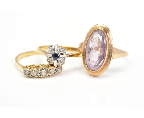 THREE GEM RINGS, to include a 9ct gold oval amethyst ring, an 18ct gold sapphire and diamond cluster ring, both with hallmark