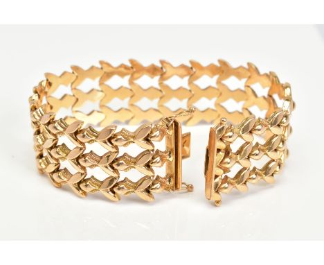A WIDE FANCY PANEL LINK BRACELET, hollow links, measuring approximately 205mm in length x 25mm in width, fitted to an integra