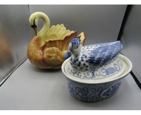 A duck egg crock and a swan planter