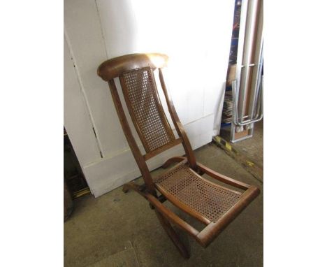 Vintage wooden deck chair with cushions