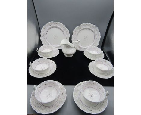 A vintage part tea set comprising 2 cake plates, 6 cups and saucers and a milk jug