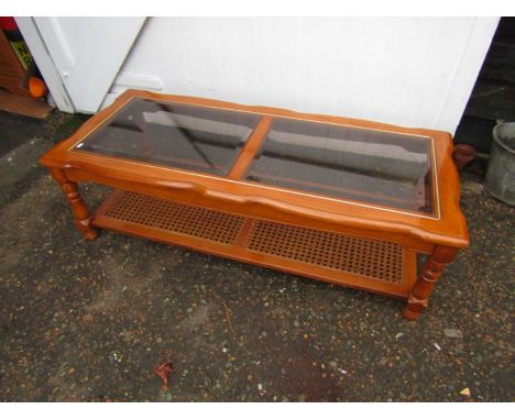 Coffee table with glass top and cane shelf underneath H41cm W134cm D58cm approx 