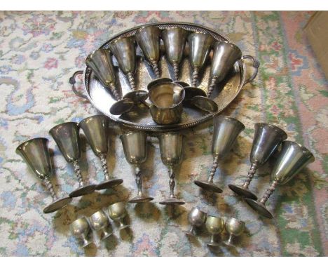 Metal goblets, egg cups and a tray