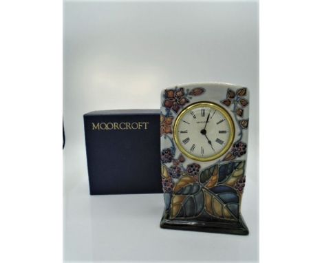 Moorcroft Bramble pattern clock designed by Sally Tuffin, marks to base, approx 16cm tall, boxed