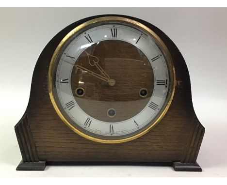 OAK MANTEL CLOCK, the circular dial with Roman numerals23cm high