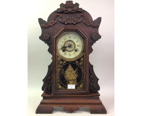 20TH CENTURY MANTEL CLOCK, the face surrounded by scrollwork, the clock raised on bracket feet