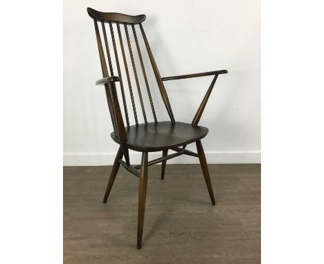 PAIR OF ERCOL GOLDSMITHS ELBOW CHAIRS, dark stainedWebbing very slack,  some colour run and marks to fabric.signs of wear to 