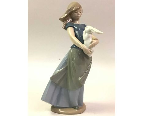 GROUP OF CERAMIC FIGURES, including a Lladro figure of a lady holding a lamb, number 4584 and various Nao figuresQty: 7