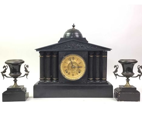 VICTORIAN ARCHITECTURAL BLACK SLATE CLOCK GARNITURE the clock with Roman numeral dial with a pair of urn shaped garniture vas