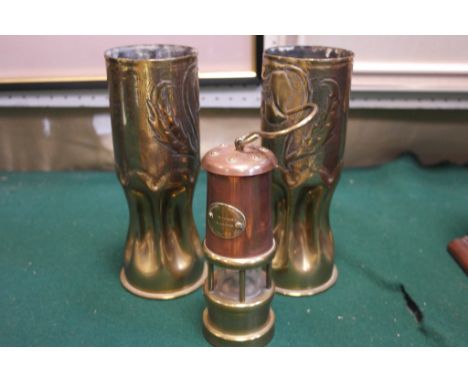 A pair of WWI trench art shells; together with a miner's lamp