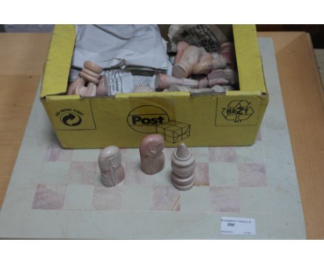 An African hardstone chess set and board