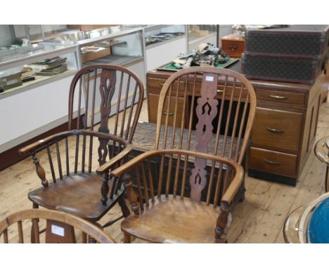 Two 19th century  elm stick back windsor chairs one with cow horn stretchers