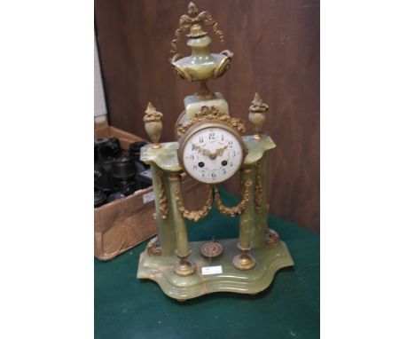 A Victorian style onyx mantle clock with ormalu mounts