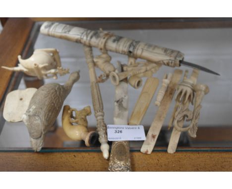 A quantity of 19th centurty carved ivory and bone items to inc goose, bone, Tanto,pipe etc