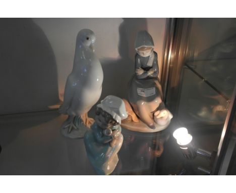 Two Lladro figures; together with a Nao dove