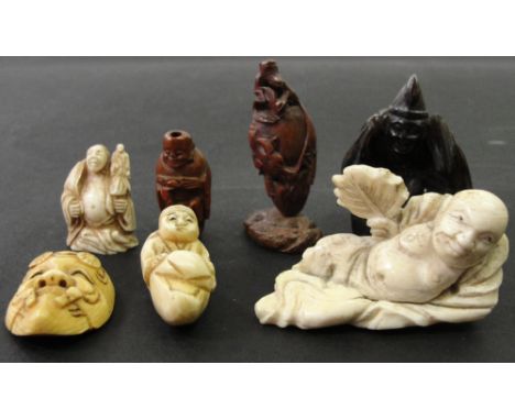 A Collection of Japanese Ojime, Netsuke and Okimono:
19th century
To include: an ivory netsuke carved as a mask; an olive sto