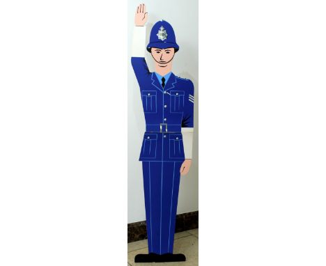 Original vintage sturdy fold-out cardboard display stand of a British policeman in a traditional blue uniform and helmet with