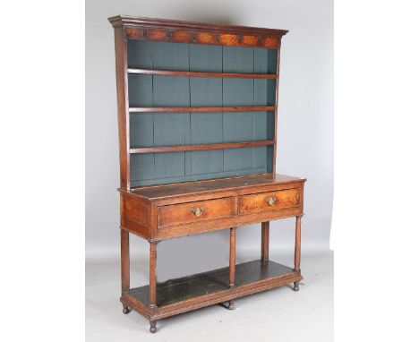 A George III provincial oak dresser, the plate rack above two drawers and an open shelf, height 211cm, width 149cm, depth 45c