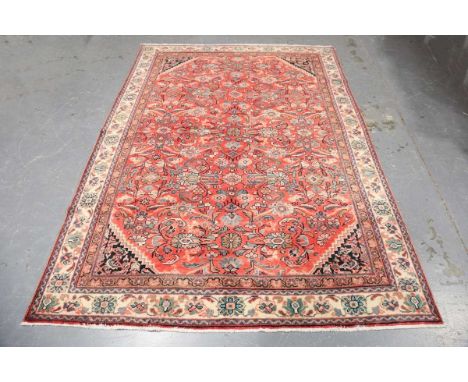 A Hamadan carpet, North-west Persia, mid-20th century, the terracotta field with overall flowerheads, leaves and palmettes, w