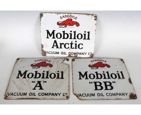 A group of three Vacuum Oil Company Ltd 'Mobiloil' enamel advertising signs, approx 22cm x 28cm.