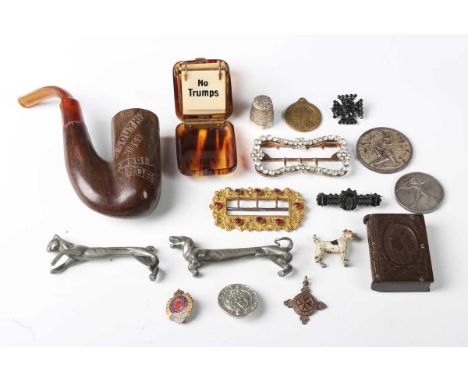 A small group of collectors' items, including a carved wooden 'Boer War' smoking pipe and a cold painted bronze model of a te