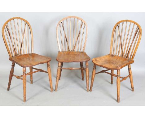 A set of three 19th century ash and elm stick back kitchen chairs, height 90cm, width 42cm.
