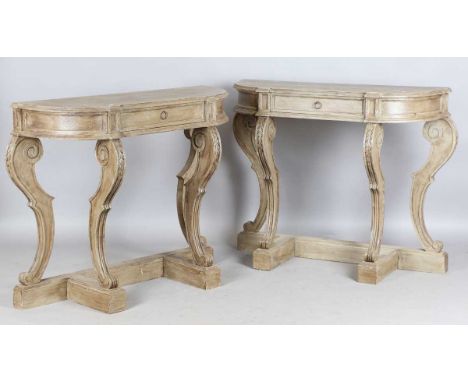 A pair of late 20th century French style grey painted console tables with shaped tops and scroll supports, height 94cm, width