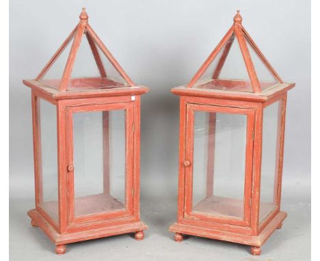 A pair of large late 20th century red painted wooden framed cloche style lantern cabinets, height 103cm, width 42cm.