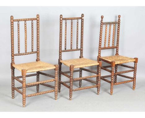 A pair of early 20th century French bobbin turned side chairs, height 109cm, width 51cm, together with another similar chair,