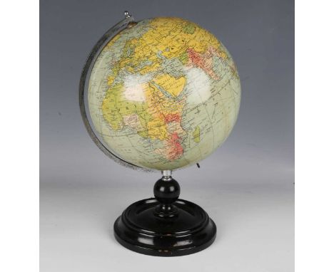 An early 20th century Philips' 'British Empire' terrestrial globe, diameter of globe 20cm, raised on an ebonized stand, heigh
