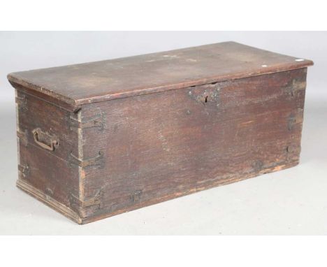 An 18th century oak trunk with metal bound corners, height 51cm, width 126cm, depth 54cm.