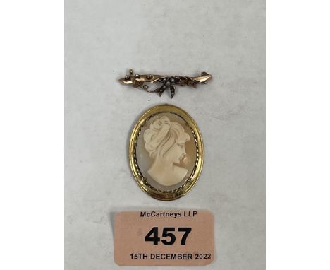 A 9ct split pearl and ruby bar brooch together with a gold framed shell cameo brooch (pin broken). 7.9g gross