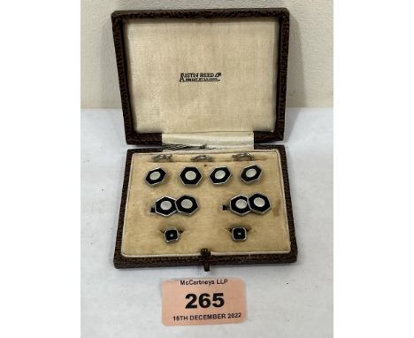 A boxed Austin Reed dress stud set