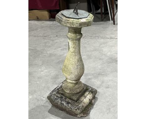 A sundial on statuary base. 37' high