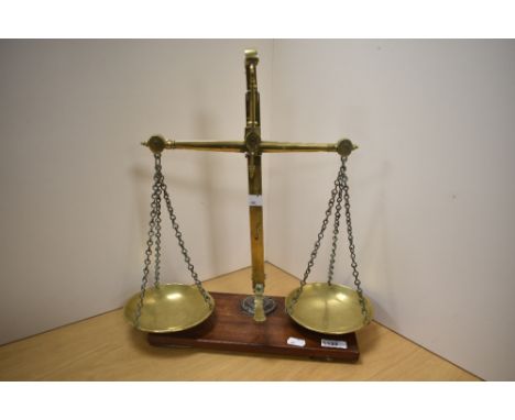 A set of Victorian brass class B beam scales, of traditional arrangement with oblong mahogany base, impressed R Fischer B'Ham