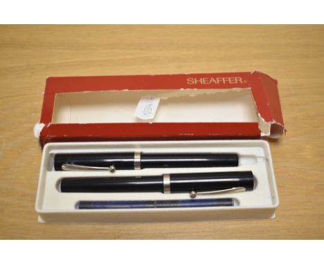 A Sheaffer No Nonsense cartridge fill fountain pen and roller ball set in black with chrome trim having Sheaffer M made in US
