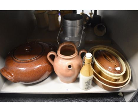 A stoneware ginger beer bottle manufactured by James Dunbar sold alongside a vintage milk churn, a large brown lidded oven di