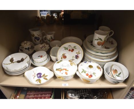 An assortment of Royal Worcester fine porcelain dinner ware comprising 'Evesham' 'Wild Harvest' etc.