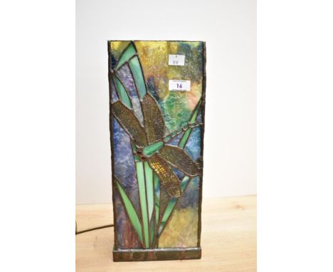 A Tiffany style glass table lamp, of rectangular form and decorated in a leaded dragon fly design, fitted for electricity and