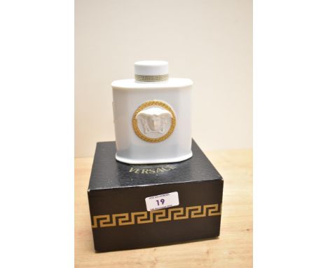 A Rosenthal porcelain Versace lidded Gorgona flask, measuring 13cm high and with box
Condition report: The porcelain flask is